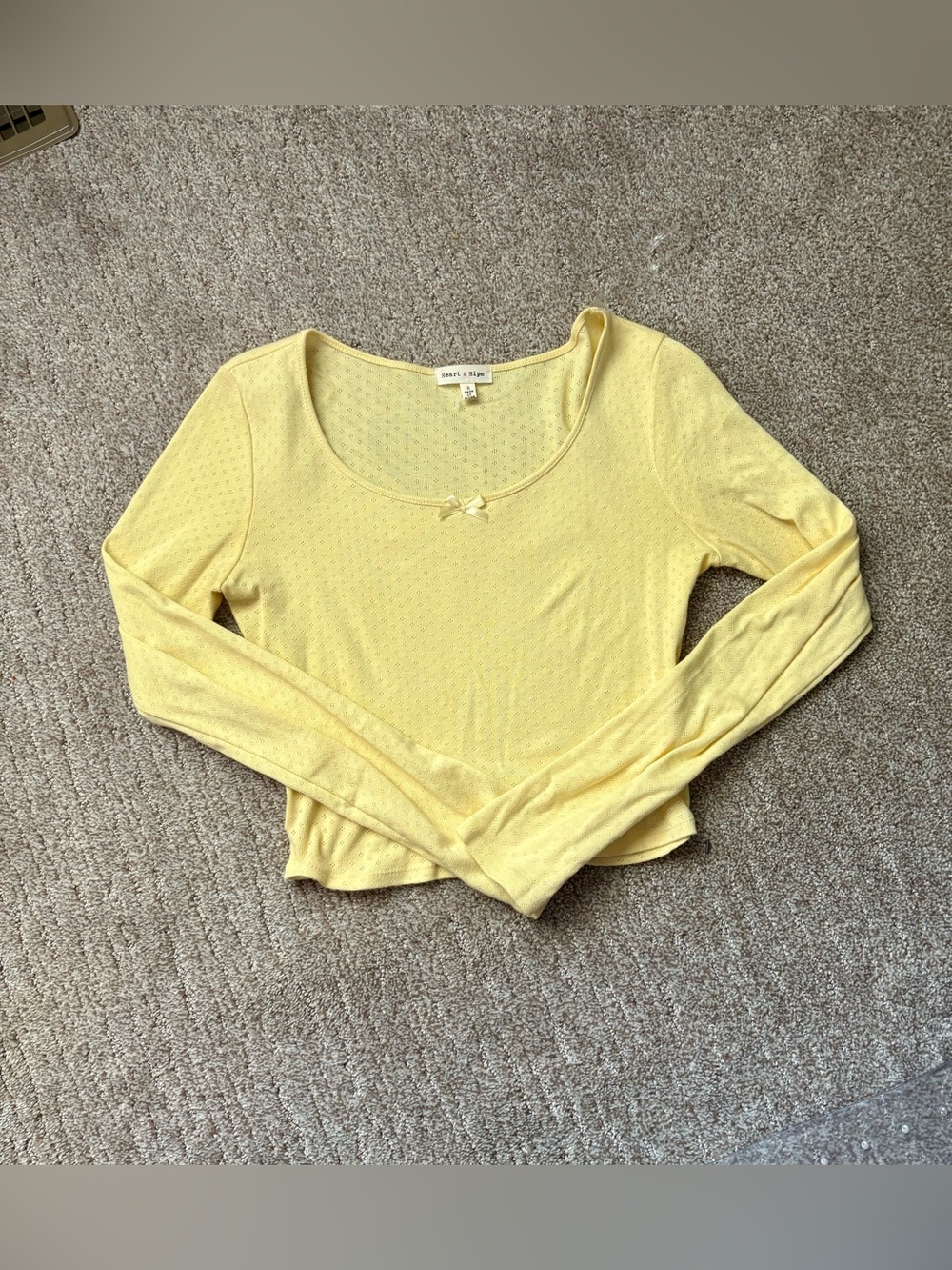Cute Heart & Hips long sleeve crop top in a soft butter yellow color